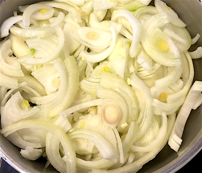 Chopped onions in pot
