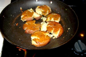 Smashed Red Potatoes frying in skillet